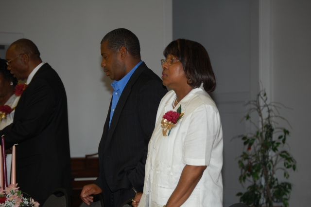 Sherman Dills and Carolyn Satchell join in the singing of the "Negro National Anthem" by James Weldon Johnson.